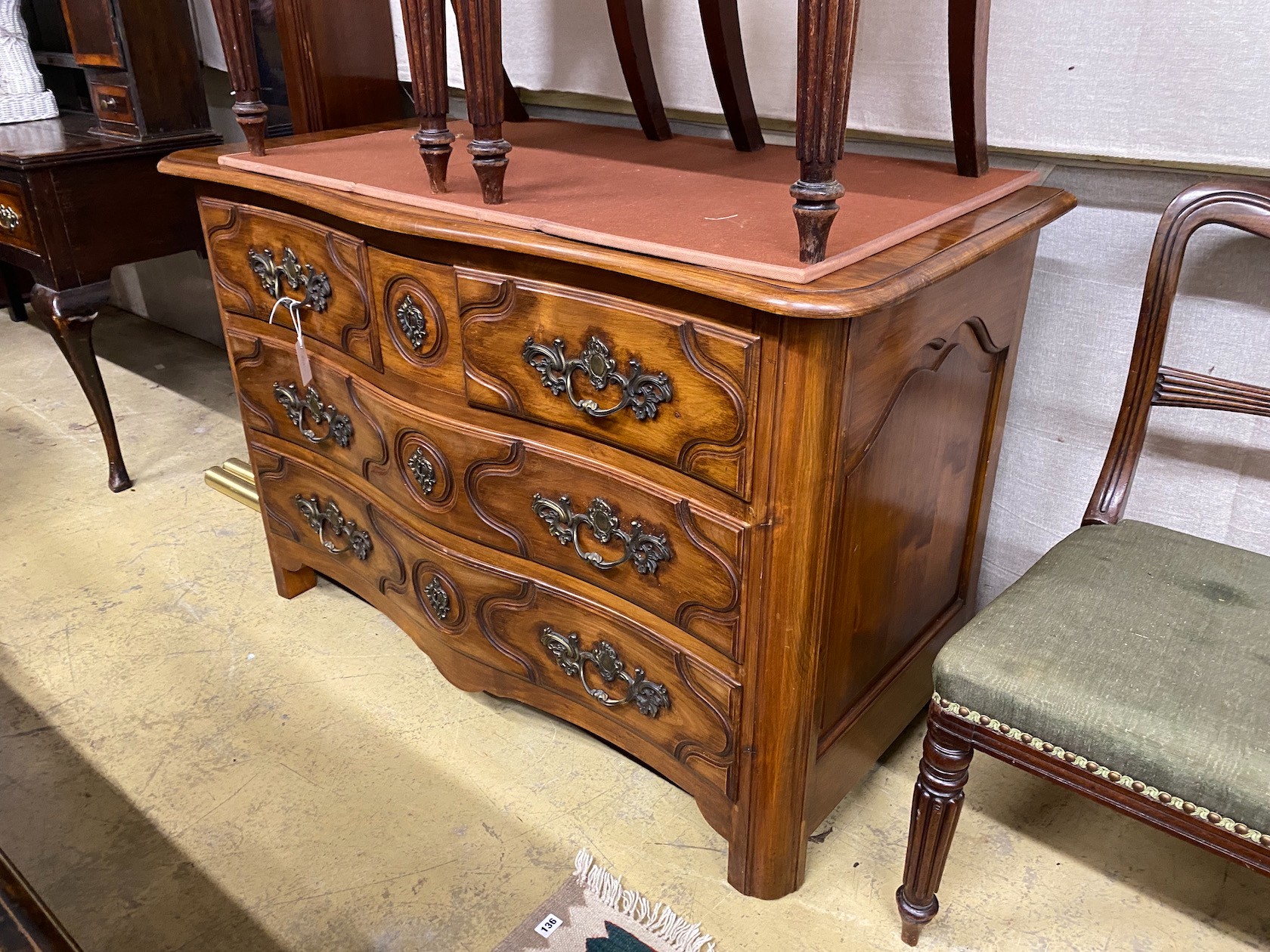 An 18th century style French walnut four drawer commode, width 126cm, depth 60cm, height 83cm